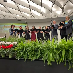 a choir singing on a stage