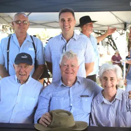 seven people under a canopy