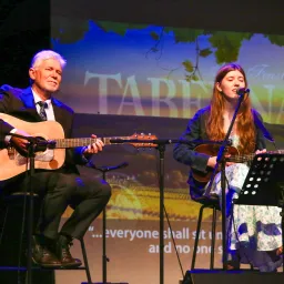 two people performing music
