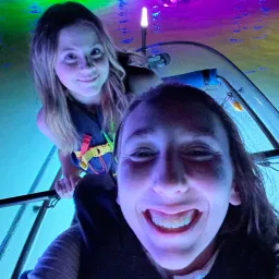 2024 Feast of Tabernacles Aransas Pass, Texas two girls on a boat with glowing water in the background