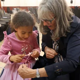 2024 Feast of Tabernacles Mossel Bay, South Africa a woman teaching a girl to knit