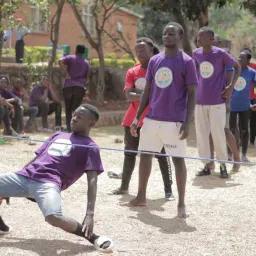 a group of children playing limbo