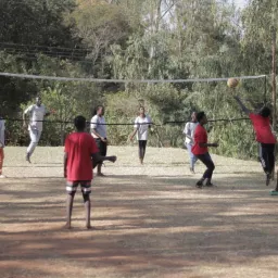 a group of campers playing volleyball
