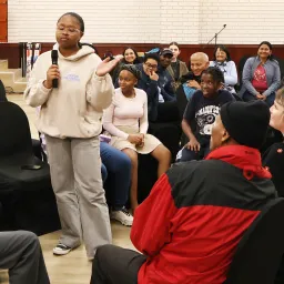 2024 Feast of Tabernacles Mossel Bay, South Africa a group discussion with one person speaking in to a microphone
