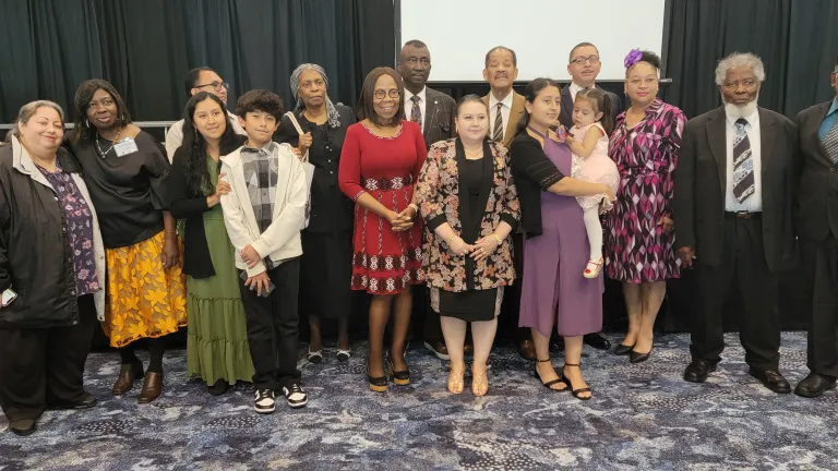 a group of people standing indoors