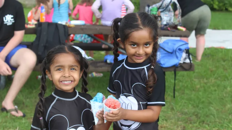 two girls holding shaved ice