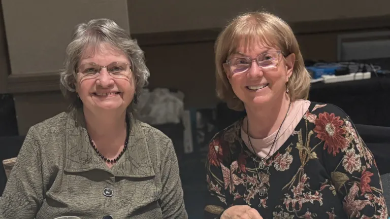 two women seated at a table