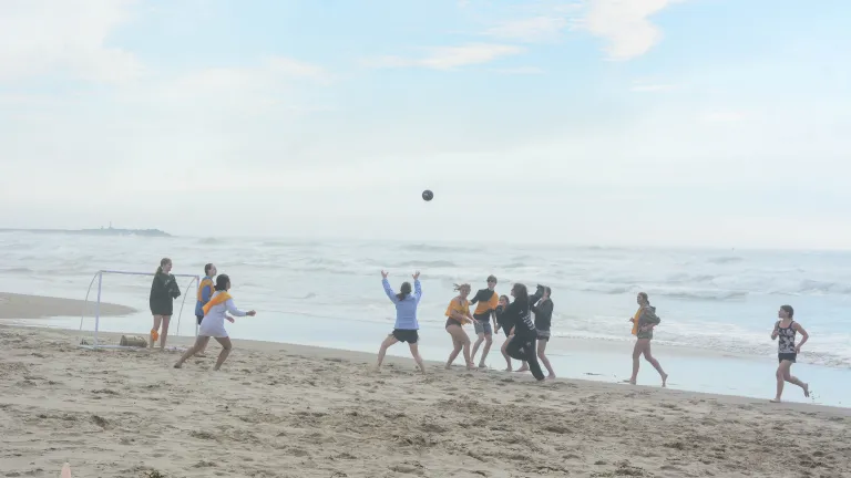 Campers playing speedaway on a beach