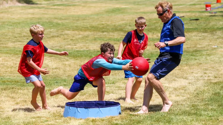 Camper diving for a ball