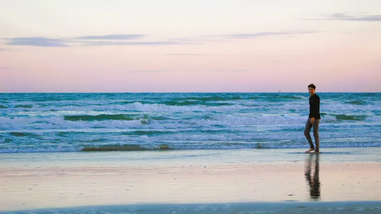 a person walking on the beach