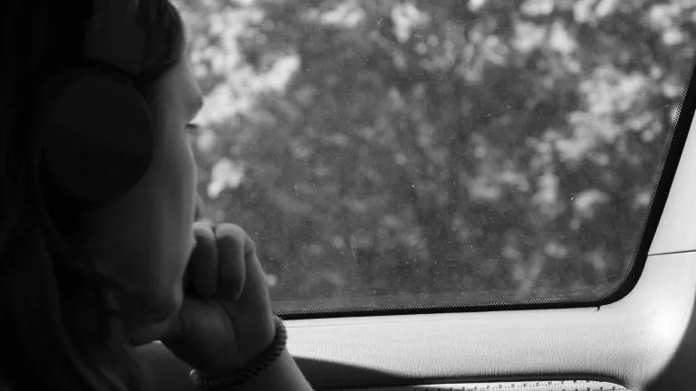 Empathy is a positive trait necessary for a healthy mental outlook and function. a woman looking out a car window