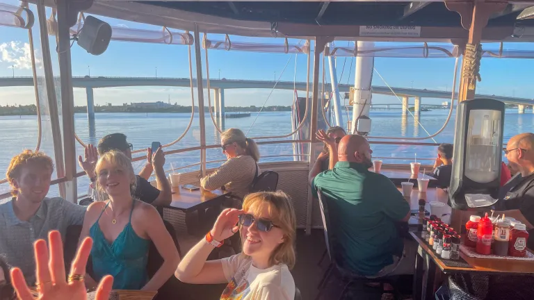 people riding a boat