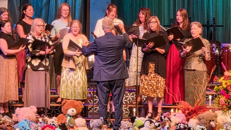 a choir performing on a stage