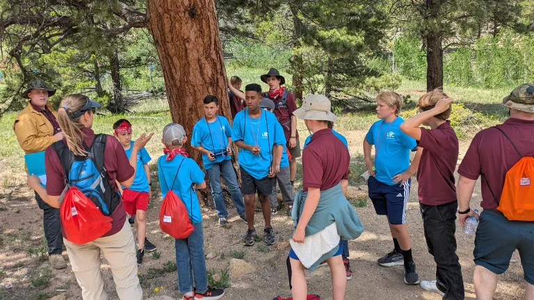 boys listening to an outdoor lesson