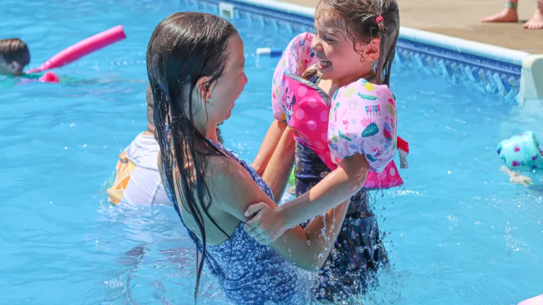 two girls in a swimming pool
