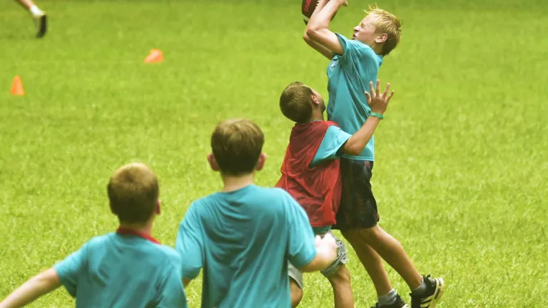 boys playing football