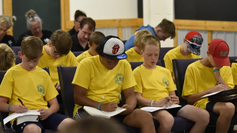 boys taking notes