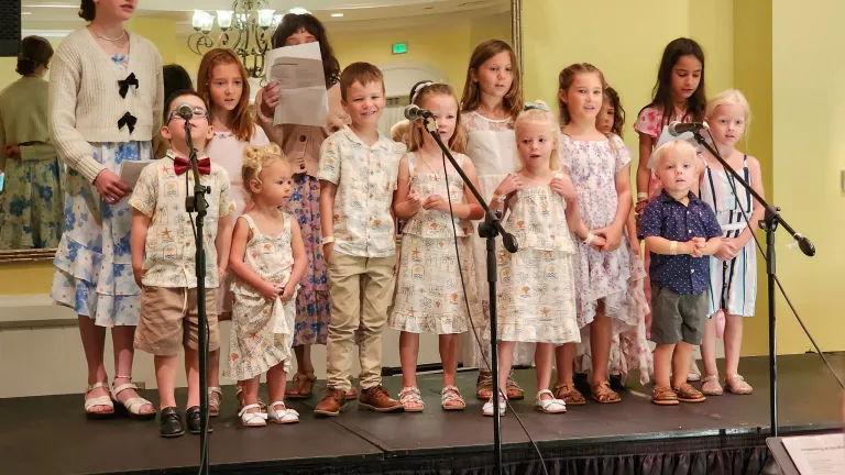a children's choir performing on stage