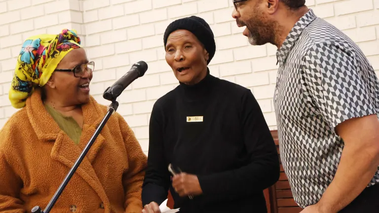 2024 Feast of Tabernacles Mossel Bay, South Africa three people talking with a microphone in front