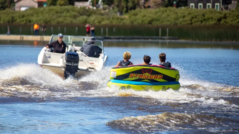 people in boats on the water