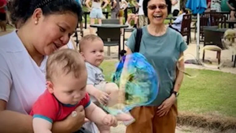 people outside blowing bubbles