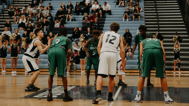 A basketball game in process - shooter at the free throw line.