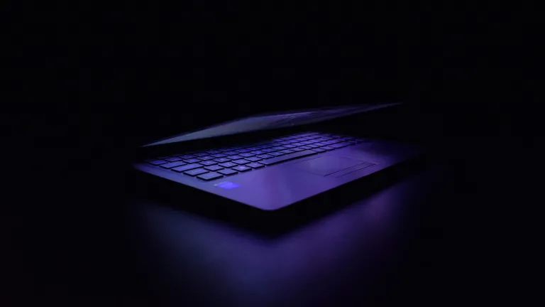 A laptop in the dark.