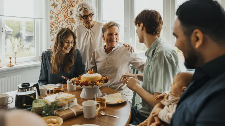 People sitting around a table eating.
