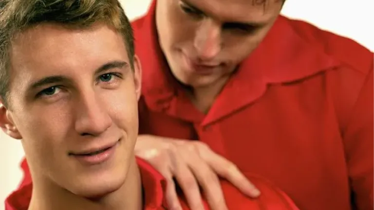 two young men wearing red shirts