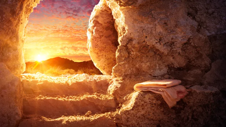A photo illustration of an open tomb.