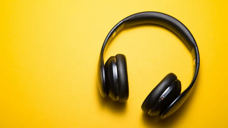 a pair of headphones on a yellow background
