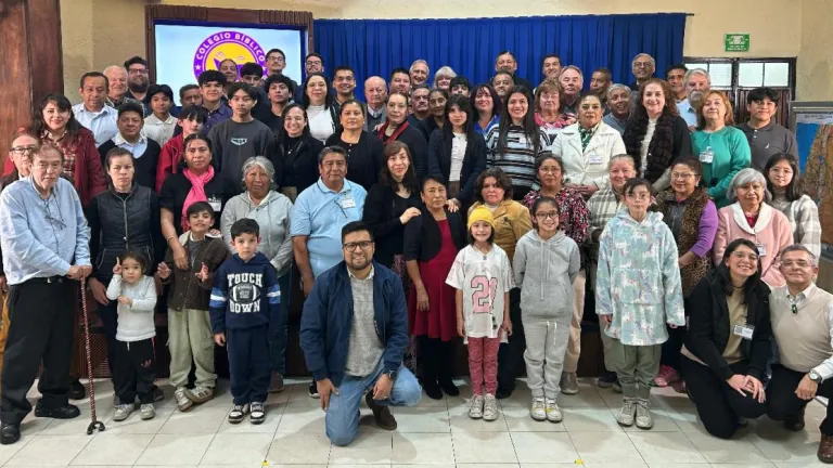 a large group of people standing indoors