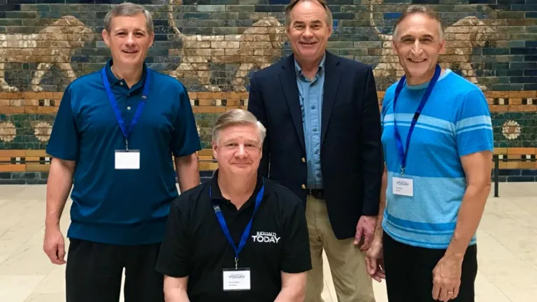 four men in a museum