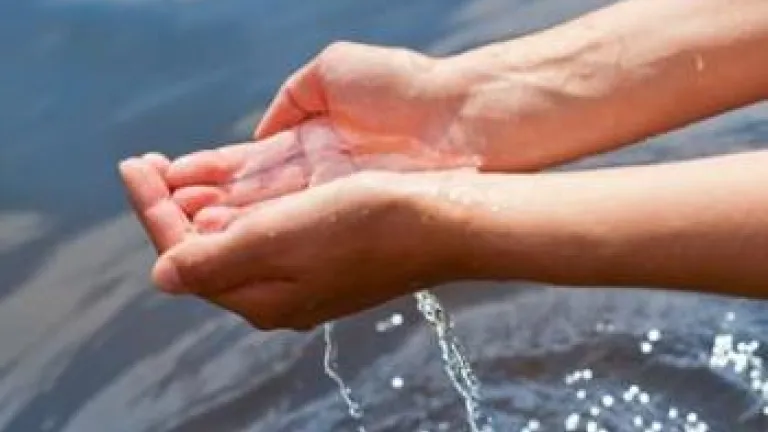 Understanding God's Word... What the Bible Says About Baptism Hands holding water over more water - Understanding God's Word... What the Bible