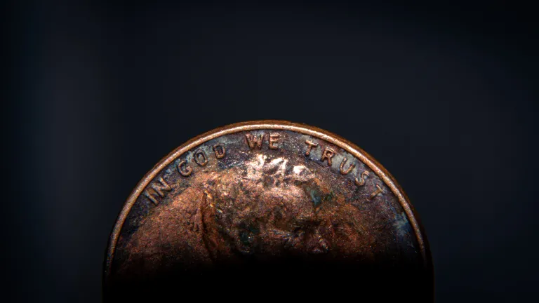 The profile of Abraham Lincoln is engraved on the front of this small coin, as well as the year the coin was minted and these inscriptions--"In God We Trust" and "Liberty." These words comforted me. The front of a penny.
