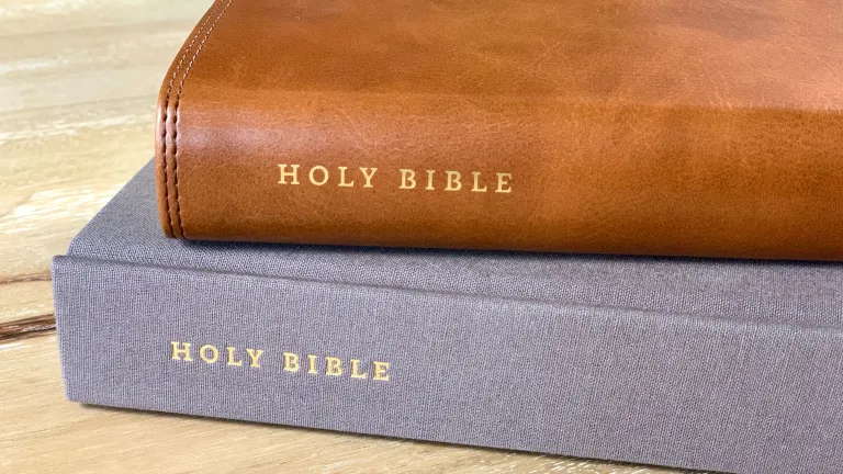 All translations from other languages into English are just that—translations. Two Bibles stacked on a table