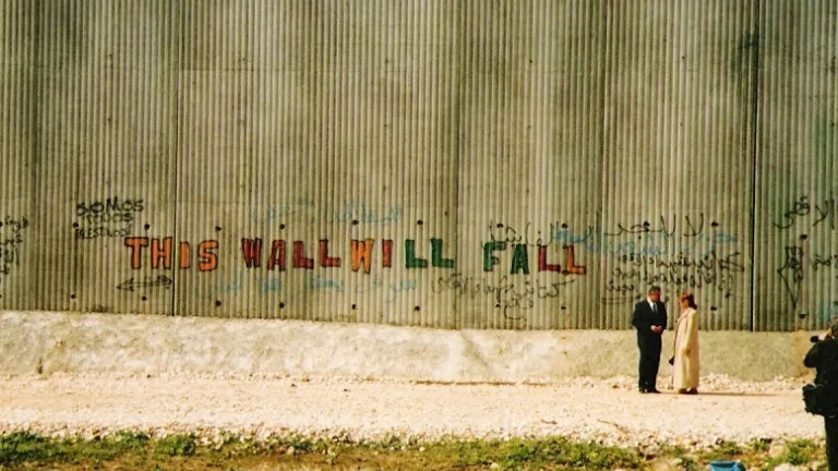 What walls are we building about us, whether knowingly or unknowingly? And if we are building walls, why? Are we walling people out or walling people in? Security wall at Qalqilya, West Bank, February 2004.
