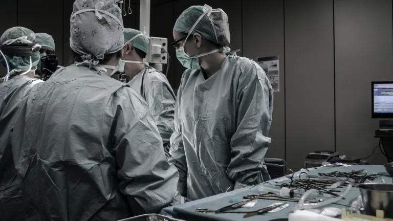 The hospital staff doesn’t have time to pontificate on the big questions of the day; they’re too busy just trying to keep people alive... “We work under the principle that we have one golden hour to save a life after a severe shock-trauma." Hospital staff preparing for surgery.