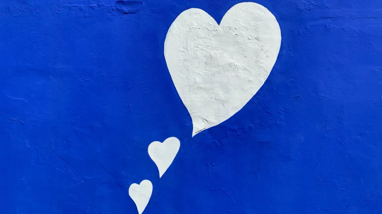 Holding your tongue or transforming your heart because you are thoughtful and caring are two very different values with two distinct destinations. White Hearts on Blue Background