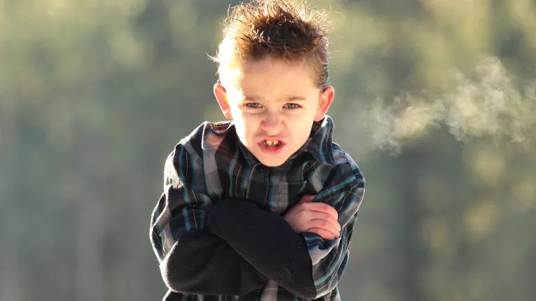 If you allow your child to have temper tantrums at a young age, you may be setting the stage for lifelong problems with anger management. A young boy looking angry.