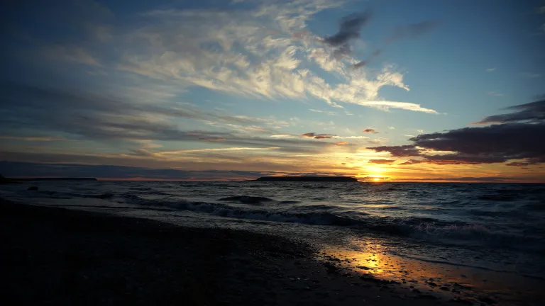 The wonderful news of the coming Kingdom of God is the heart and core of Jesus Christ's message for humanity. Sunset over the ocean.