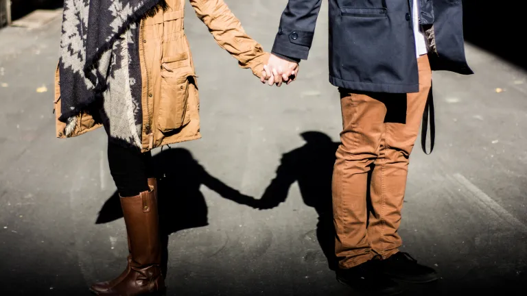 Sometimes being godly is the most challenging when you meet the person you plan to marry. A young couple holding hands while walking.