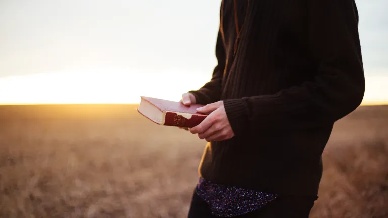 A man holding a Bible.