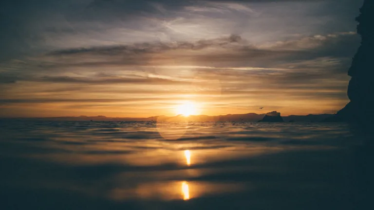 The change from Sabbath to Sunday was made long after the writing of the New Testament. Sunset over water.