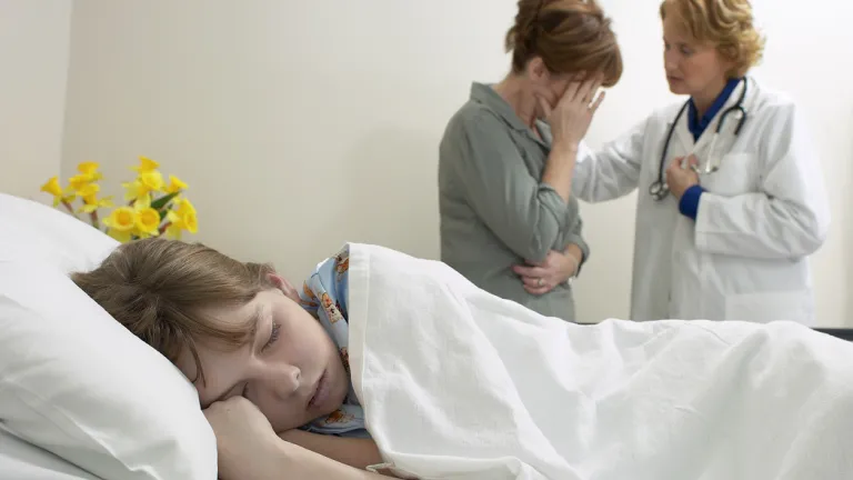 Tragic events are all around us. We’re especially disturbed when children’s lives are cut short by accidents, crime or illness. A young child laying in bed with a mother and doctor in the background.