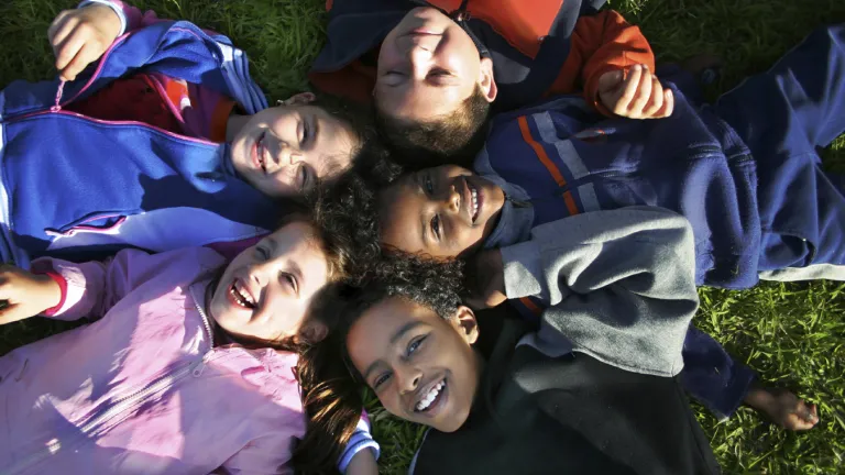 This period is the time for all other people to learn the truth of God and enjoy the same opportunity for salvation given to those who lived during the Millennium. Young kids laying on the ground and looking up.