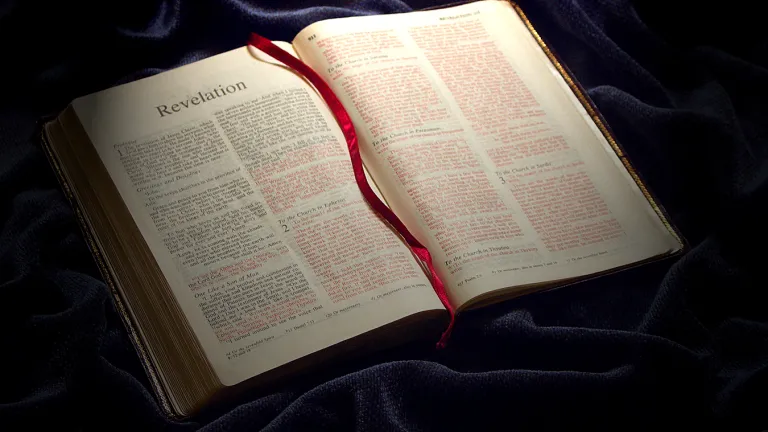 Much of the Bible is prophecy, and of those prophecies concern the end of this age and a glorious new age to begin at Jesus Christ’s return. A Bible opened to the book of Revelation.