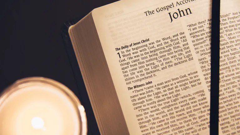 A Bible opened to the book John.
