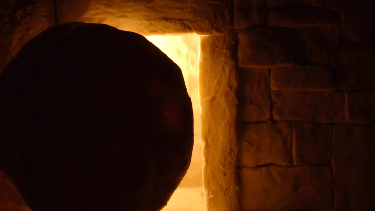 The heavy stone sealing the tomb in which Jesus was laid was rolled away not to let Him out, but to let His followers and others see that the tomb was empty and He was risen. A round stone in front of a tomb.