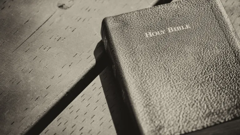 A Bible laying on a table.